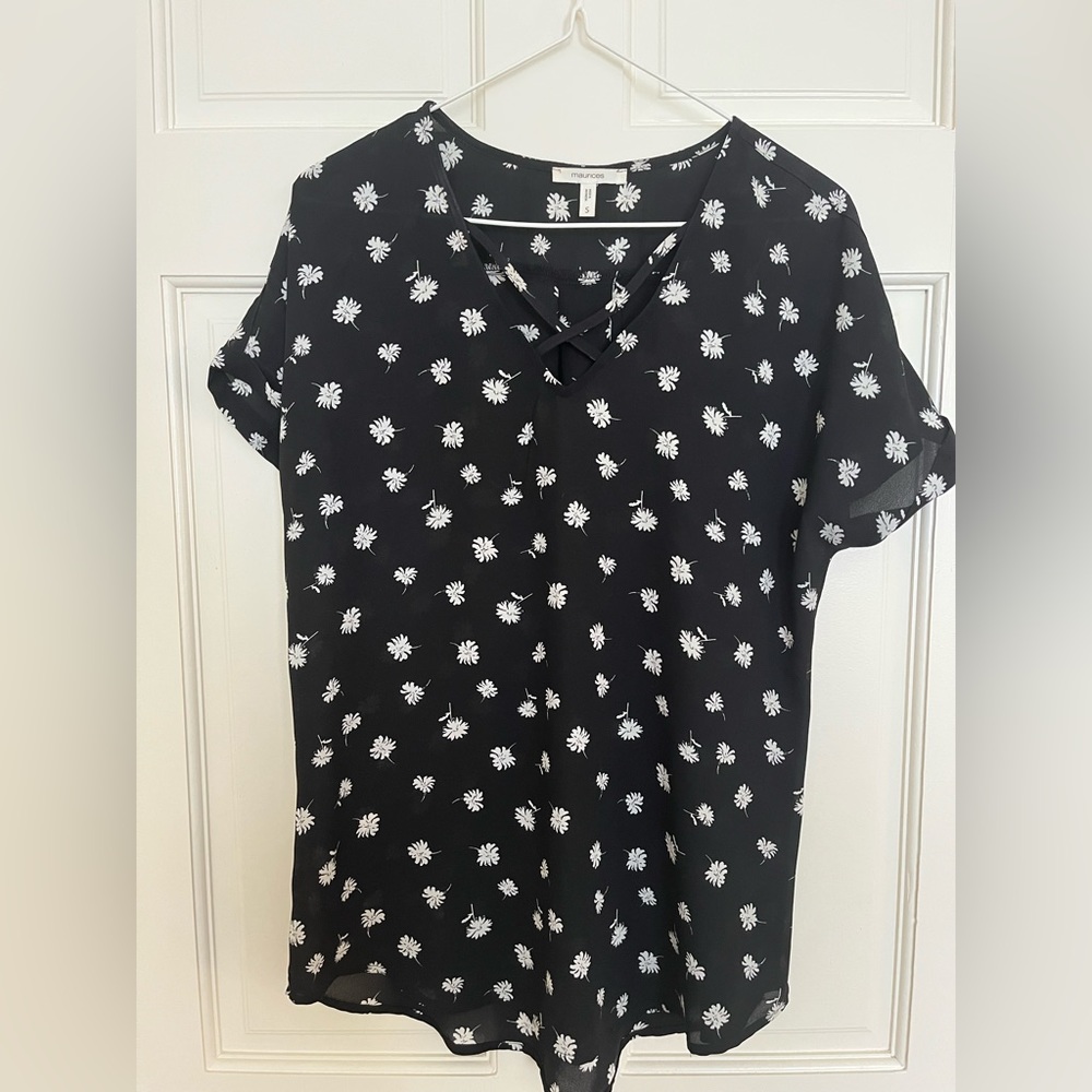 MAURICES-Size S- Women’s black floral blouse with cut-out neck design.